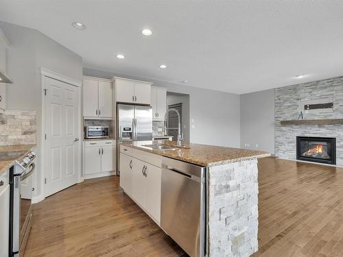 9 Southfork Close, Leduc, AB - Indoor Photo Showing Kitchen With Fireplace With Upgraded Kitchen