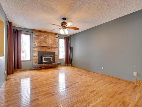 51 Windermere Drive, Spruce Grove, AB - Indoor Photo Showing Living Room With Fireplace