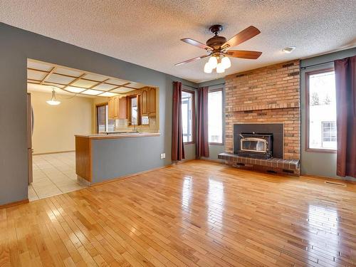 51 Windermere Drive, Spruce Grove, AB - Indoor Photo Showing Living Room With Fireplace