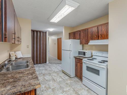 #302 10035-164 Street Nw, Edmonton, AB - Indoor Photo Showing Kitchen With Double Sink