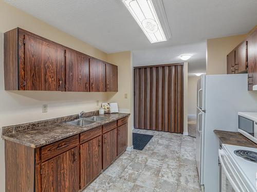 #302 10035-164 Street Nw, Edmonton, AB - Indoor Photo Showing Kitchen With Double Sink