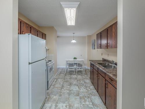 #302 10035-164 Street Nw, Edmonton, AB - Indoor Photo Showing Kitchen With Double Sink