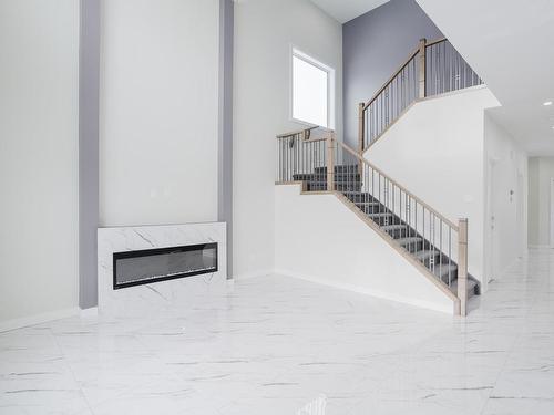 1213 11 Avenue, Edmonton, AB - Indoor Photo Showing Other Room With Fireplace