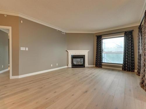 408 10108 125 Street, Edmonton, AB - Indoor Photo Showing Living Room With Fireplace