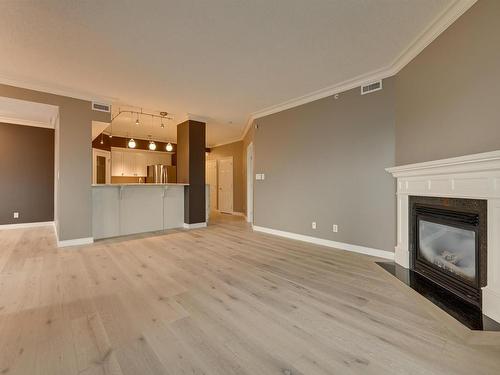 408 10108 125 Street, Edmonton, AB - Indoor Photo Showing Living Room With Fireplace