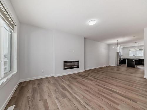 4120 66 Street, Beaumont, AB - Indoor Photo Showing Other Room With Fireplace