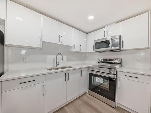 4120 66 Street, Beaumont, AB - Indoor Photo Showing Kitchen With Double Sink