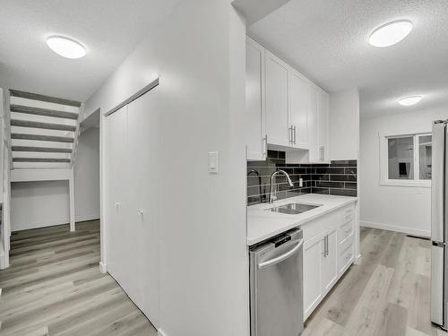 21E Meadowlark Village, Edmonton, AB - Indoor Photo Showing Kitchen With Double Sink