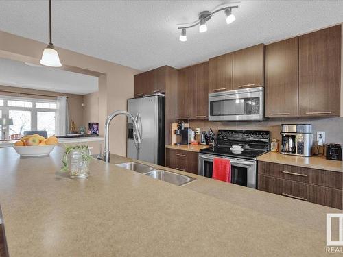 3608 12 St, Edmonton, AB - Indoor Photo Showing Kitchen With Double Sink