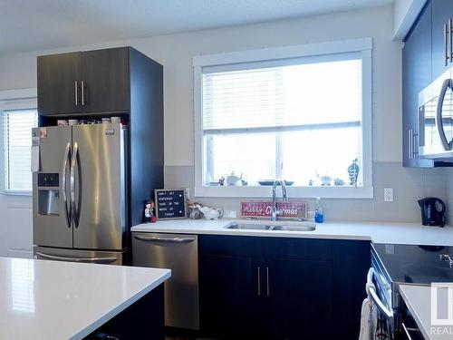 2206 8530 94 Street, Fort Saskatchewan, AB - Indoor Photo Showing Kitchen With Stainless Steel Kitchen With Double Sink