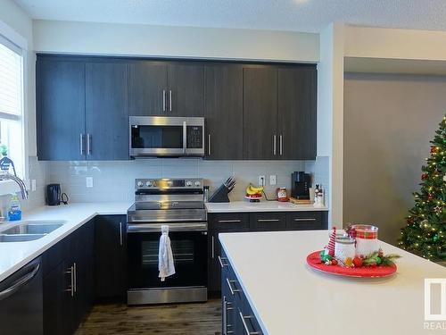 2206 8530 94 Street, Fort Saskatchewan, AB - Indoor Photo Showing Kitchen With Stainless Steel Kitchen With Double Sink