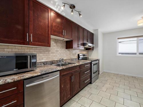 8716 136 Avenue, Edmonton, AB - Indoor Photo Showing Kitchen With Double Sink