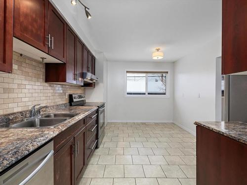 8716 136 Avenue, Edmonton, AB - Indoor Photo Showing Kitchen With Double Sink