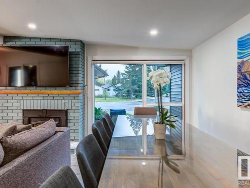 7502 155 Street, Edmonton, AB - Indoor Photo Showing Dining Room With Fireplace