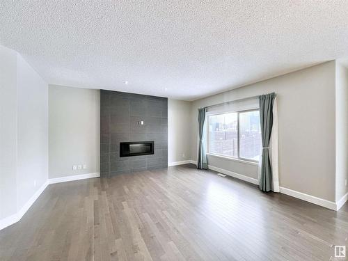 2087 Ware Road, Edmonton, AB - Indoor Photo Showing Living Room With Fireplace