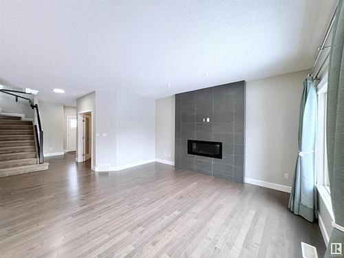 2087 Ware Road, Edmonton, AB - Indoor Photo Showing Other Room With Fireplace