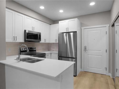 322 12804 140 Avenue, Edmonton, AB - Indoor Photo Showing Kitchen With Double Sink With Upgraded Kitchen