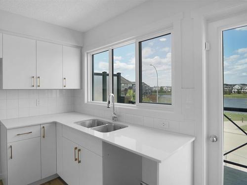 47 1025 Secord Promenade, Edmonton, AB - Indoor Photo Showing Kitchen With Double Sink