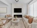 100 1025 Secord Promenade, Edmonton, AB  - Indoor Photo Showing Living Room With Fireplace 