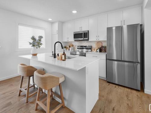 100 1025 Secord Promenade, Edmonton, AB - Indoor Photo Showing Kitchen With Upgraded Kitchen