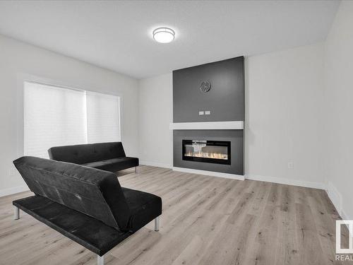 17234 9 Avenue, Edmonton, AB - Indoor Photo Showing Living Room With Fireplace