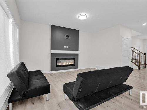 17234 9 Avenue, Edmonton, AB - Indoor Photo Showing Living Room With Fireplace