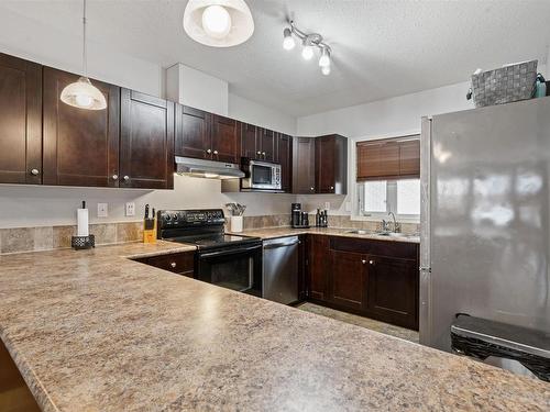 202 802 -12 Street, Cold Lake, AB - Indoor Photo Showing Kitchen With Double Sink