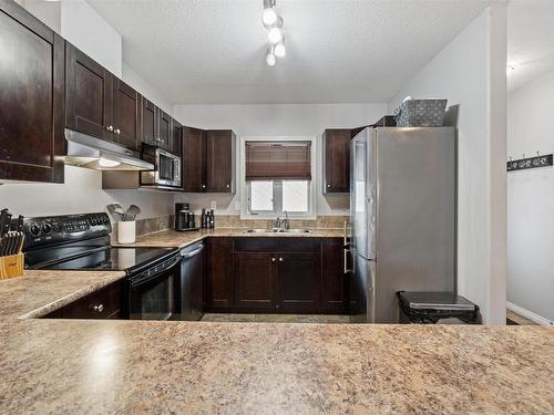 202 802 -12 Street, Cold Lake, AB - Indoor Photo Showing Kitchen With Double Sink