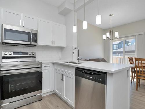 47 603 Orchards Boulevard, Edmonton, AB - Indoor Photo Showing Kitchen With Stainless Steel Kitchen With Double Sink With Upgraded Kitchen