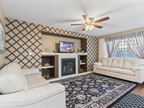 15104 31 Street Nw, Edmonton, AB - Indoor Photo Showing Living Room With Fireplace