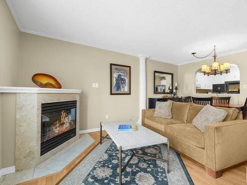 212 10610 76 Street Nw, Edmonton, AB - Indoor Photo Showing Living Room With Fireplace