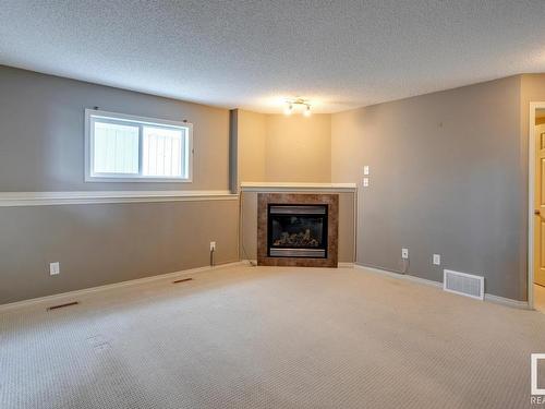 7669 Schmid Crescent, Edmonton, AB - Indoor Photo Showing Living Room With Fireplace