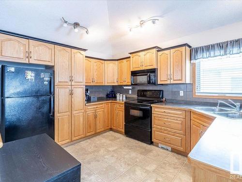 674 Kananaskis Drive, Devon, AB - Indoor Photo Showing Kitchen With Double Sink