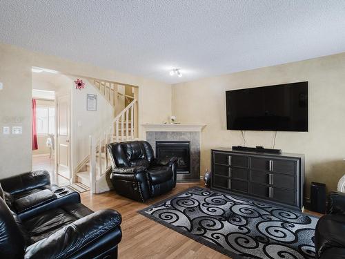 3011 21 Avenue, Edmonton, AB - Indoor Photo Showing Living Room With Fireplace