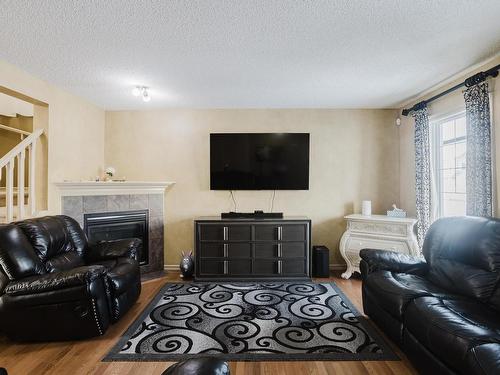 3011 21 Avenue, Edmonton, AB - Indoor Photo Showing Living Room With Fireplace