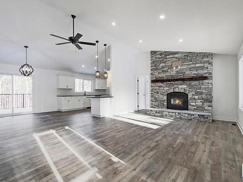 311 55504 Rr 13, Rural Lac Ste. Anne County, AB - Indoor Photo Showing Living Room With Fireplace