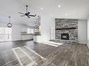 311 55504 Rr 13, Rural Lac Ste. Anne County, AB  - Indoor Photo Showing Living Room With Fireplace 