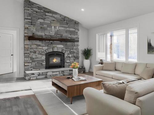 311 55504 Rr 13, Rural Lac Ste. Anne County, AB - Indoor Photo Showing Living Room With Fireplace