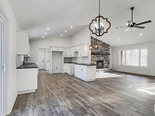 311 55504 Rr 13, Rural Lac Ste. Anne County, AB - Indoor Photo Showing Kitchen With Fireplace