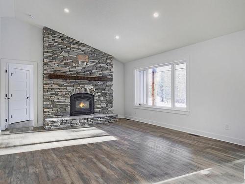 311 55504 Rr 13, Rural Lac Ste. Anne County, AB - Indoor Photo Showing Living Room With Fireplace