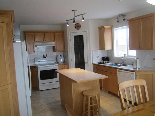 150 Pipestone Drive, Millet, AB - Indoor Photo Showing Kitchen With Double Sink