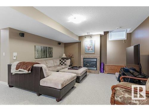 805 Proctor Wynd, Edmonton, AB - Indoor Photo Showing Other Room With Fireplace