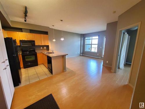 1-311 4245 139 Avenue, Edmonton, AB - Indoor Photo Showing Kitchen With Double Sink