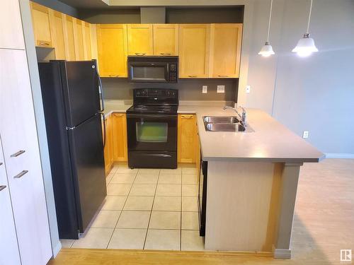 1-311 4245 139 Avenue, Edmonton, AB - Indoor Photo Showing Kitchen With Double Sink