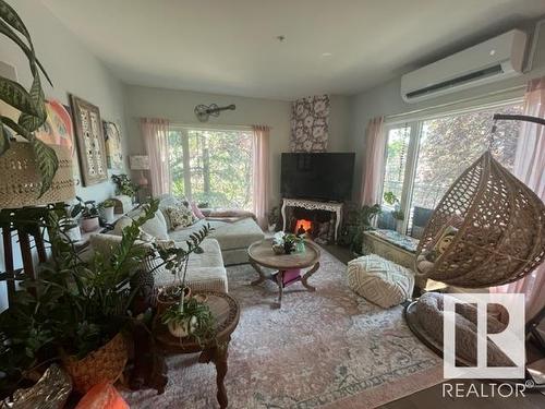 204 11415 100 Avenue, Edmonton, AB - Indoor Photo Showing Living Room With Fireplace