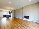 3704 2 St, Edmonton, AB  - Indoor Photo Showing Living Room With Fireplace 