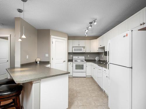 404A 6 Spruce Ridge Drive, Spruce Grove, AB - Indoor Photo Showing Kitchen With Double Sink