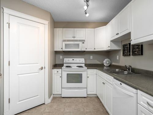 404A 6 Spruce Ridge Drive, Spruce Grove, AB - Indoor Photo Showing Kitchen With Double Sink