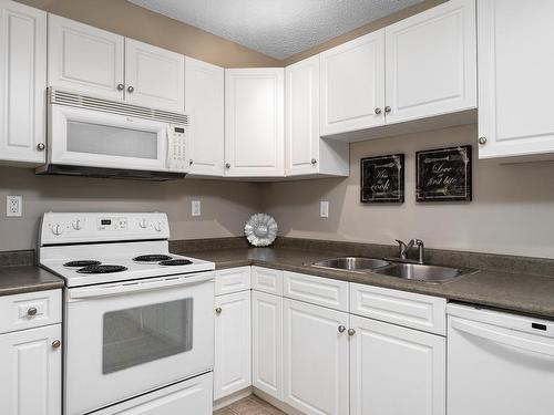 404A 6 Spruce Ridge Drive, Spruce Grove, AB - Indoor Photo Showing Kitchen With Double Sink