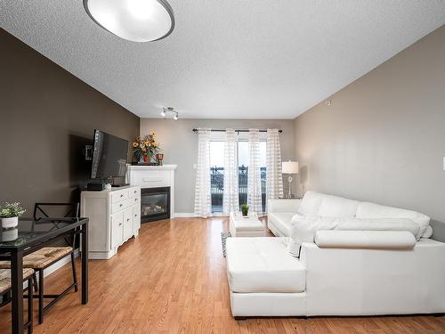 404A 6 Spruce Ridge Drive, Spruce Grove, AB - Indoor Photo Showing Living Room With Fireplace